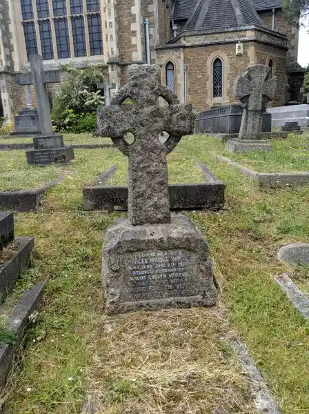 Solar cross on a tombstone in cemetery, London